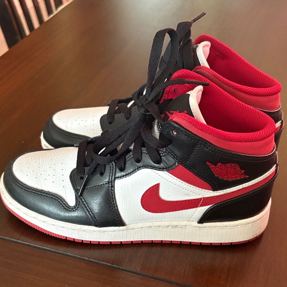 Nike Air Jordan Black, Red, and White High Tops